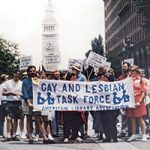 Members of ALA Gay and Lesbian Task Force marching with sign