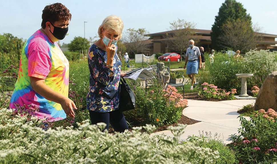 Human visitors explore the butterfly garden at Kokomo–Howard County (Ind.) Public Library’s South branch. (Photo: Kokomo–Howard County (Ind.) Public Library)