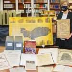 Ellen Keith, director of the Chicago History Museum Library, displays items related to the Great Chicago Fire. Photo by Rebecca Lomax/American Libraries