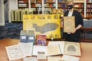 Ellen Keith, director of the Chicago History Museum Library, displays items related to the Great Chicago Fire. Photo by Rebecca Lomax/American Libraries