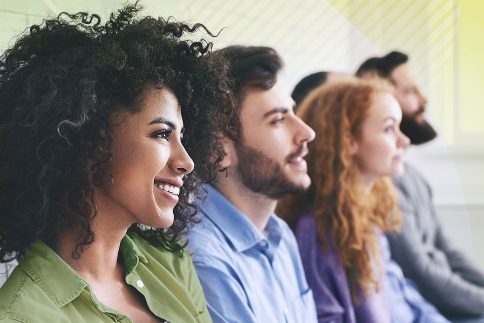 Young people sitting in an audience