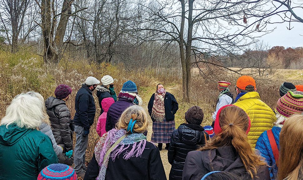 Madison (Wis.) Public Library's first Native Storyteller-in-Residence, A. J. “Andi” Cloud, leads a harvest walk in the city’s Edna Taylor Conservation Park last fall. Photo: Madison (Wis.) Public Library.