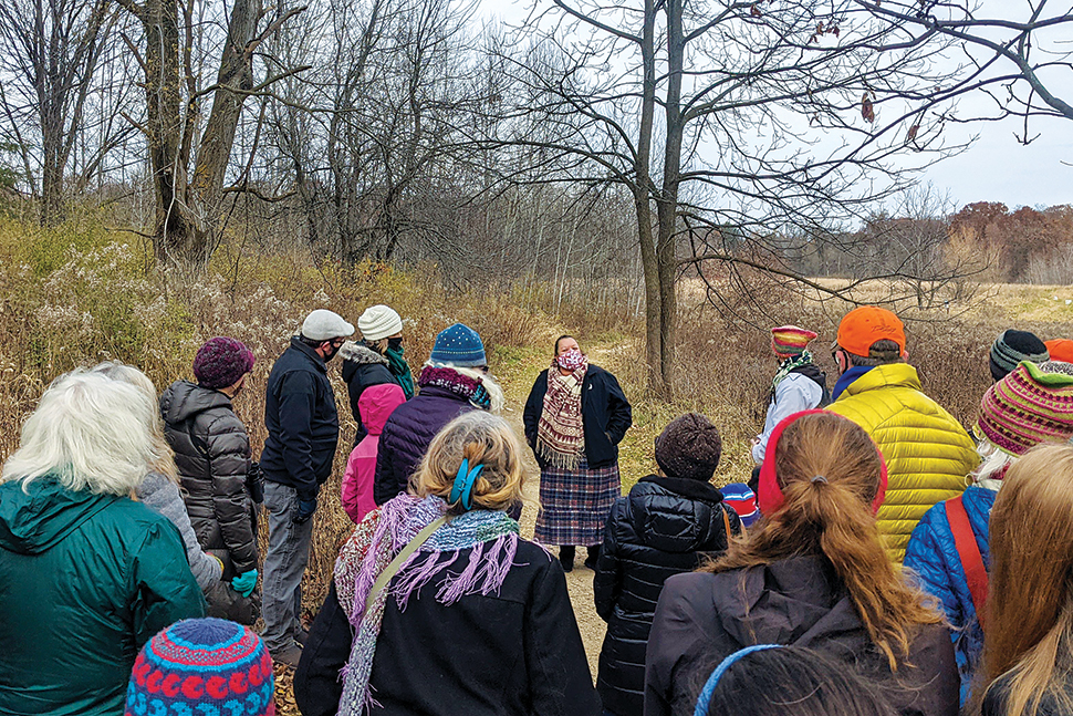 Madison (Wis.) Public Library's first Native Storyteller-in-Residence, A. J. “Andi” Cloud, leads a harvest walk in the city’s Edna Taylor Conservation Park last fall. Photo: Madison (Wis.) Public Library.