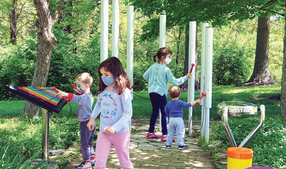 Photo of young patrons playing in the music garden at Pickerington (Ohio) Public Library.