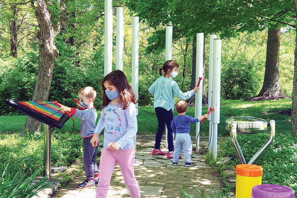 Photo of young patrons playing in the music garden at Pickerington (Ohio) Public Library.