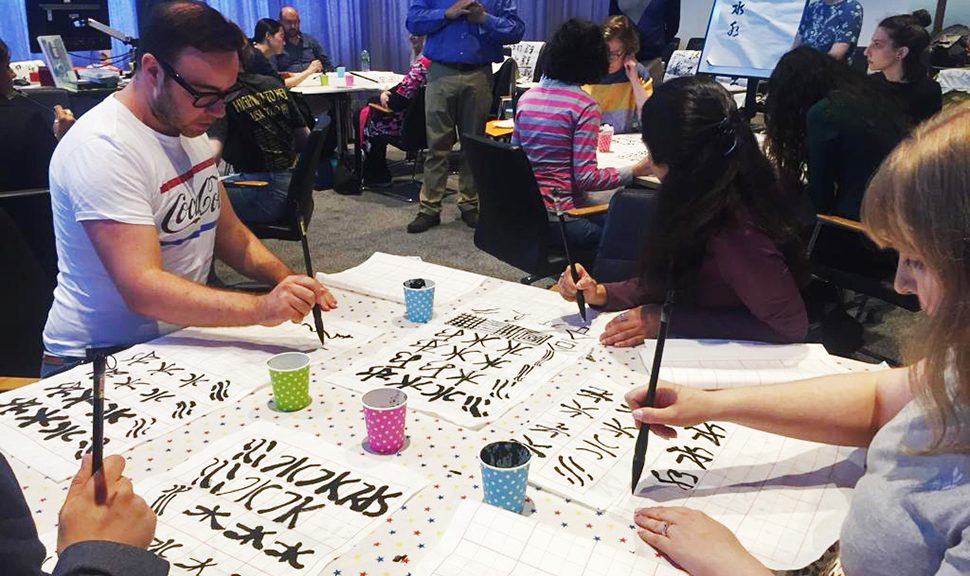 Photograph of students participating in Calligraphy Connections project