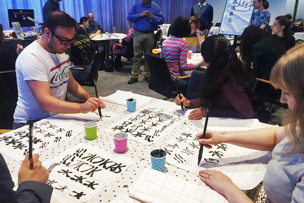 Photograph of students participating in Calligraphy Connections project