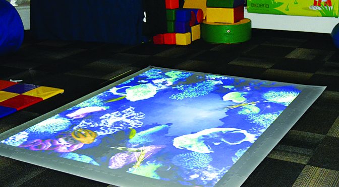 Experia USA’s interactive game floor projects images that react to movement and play.
