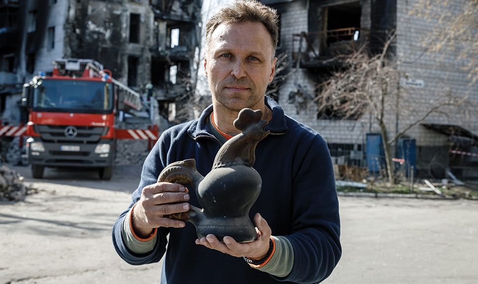 Ihor Poshyvailo, founder of Maidan Museum in Kyiv, holds the ceramic cockerel that has become a symbol of Ukrainian resistance.
