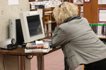 Woman using a library catalog computer