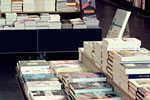 Chaotically stacked books in a bookstore