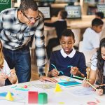 Kids working on a project in a library