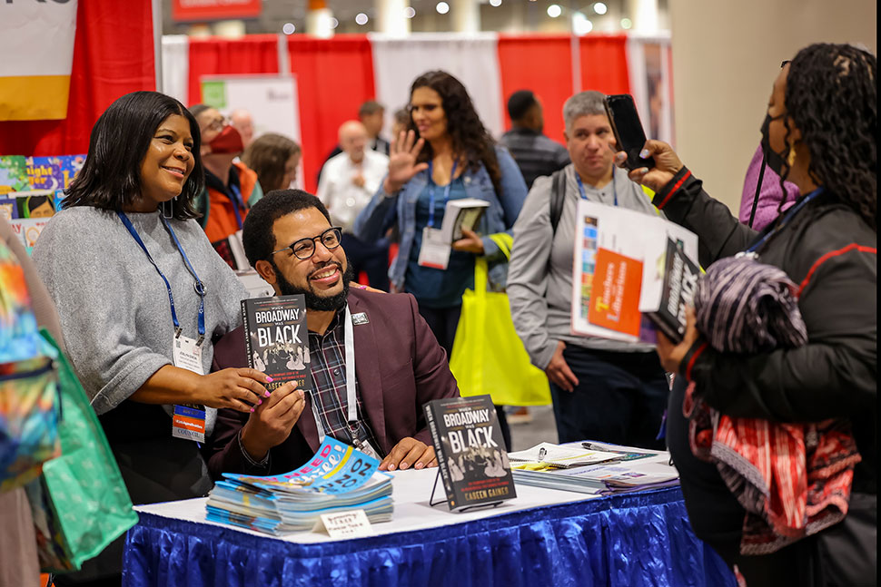 Joslyn Dixon (left), executive director of Oak Park (Ill.) Public Library, poses with author Caseen Gaines in the LLX Marketplace.