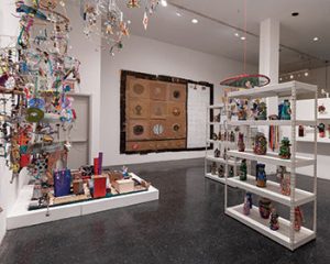 The interior of Intuit, showing various art pieces on shelves and hanging