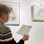 A student from the English for Older Beginners class at Jones Library in Amherst, Massachusetts works on a scavenger hunt during one of the class's field trips.