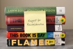 Stack of five library books with a post-it note that reads Request for Reconsideration