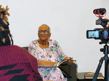 Aleah Parsons (left), archivist at Houston Public Library’s African American History Research Center, interviews Melba Ozenne, the first female officer in the Department of Public Safety at Texas Southern University in Houston. 