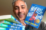 Maulik Pancholy with copies of his book, Nikhil Out Loud