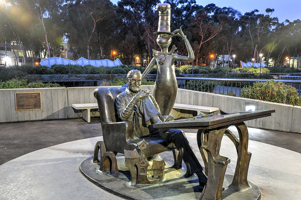 Photo of the bronze Dr. Seuss and Cat in the Hat statue outside Geisel Library, the main library of University of California San Diego