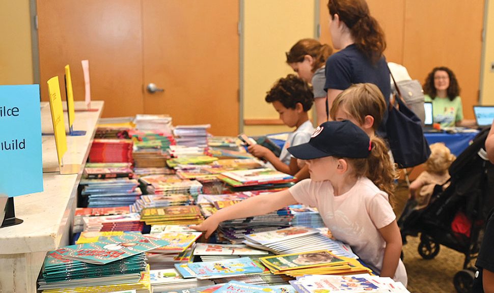 Summer reading program participants at Montgomery County (Md.) Public Libraries choose brand-new books to take home, courtesy of Friends of the Library, Montgomery County.