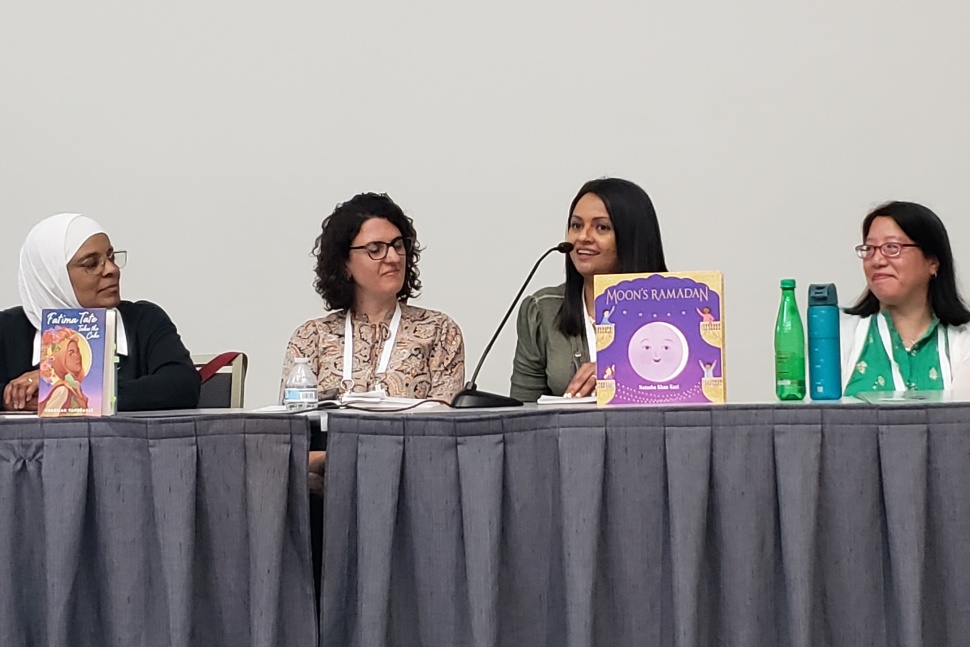 Authors Khadijah VanBrakle, Huda Al-Marashi, Natasha Khan Kazi, and Diana Ma at a table.