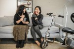 Two women with a knee scooter in frame, from the Disabled and Here Collection