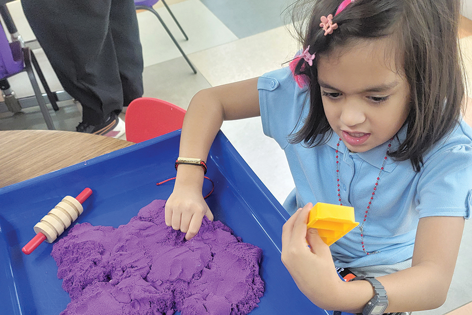 A young patron at Joeten-Kiyu Public Library in Susupe, Northern Mariana Islands plays in the library's new Sensory Corner