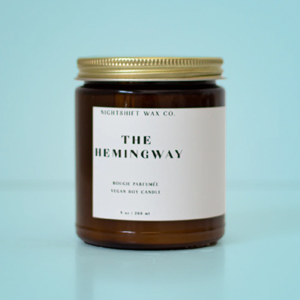 jar candle with a white label reading "The Hemingway"