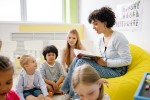 Woman reading to a group of children