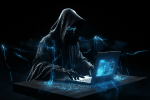 Hooded figure in the dark at a computer