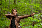 Jennifer Lawrence using a bow and arrow in a screencap from The Hunger Games