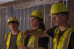 Construction trades students at Shikellamy Area High School touring the library space they are renovating
