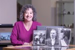 Jennifer Beals, assistant dean and director of the Betsey B. Creekmore Special Collections and University Archives at University of Tennessee, Knoxville (UTK), poses with items from the library's Scopes Trial collection.