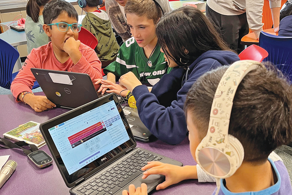 Fourth-grade students at George A. Jackson Elementary School in Jericho, New York, work on podcasts. The project was spearheaded by their librarian and teachers.Photo: Lauren Kawasaki