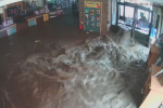 Flood water rushes into the lobby of Allegany County (Md.) Library's Westernport Library on May 13.