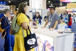 Author Alex Segura signs copies of Dick Tracy at the Hoopla booth. Rebecca Lomax/American Libraries