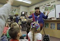 Librarian reading to a class in a screencap from Overdue