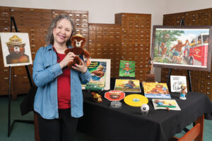 Sara Lee with Smokey Bear memorabilia at the National Agricultural Library