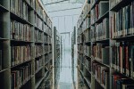 Row of library shelves in front of a window