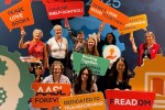 AASL National Conference attendees holding bright, enthusiastic signs
