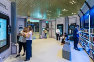 A group of patrons examining displays and books at the pop-up Star Wars Library at Singapore's Changi Airport