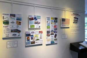 Dozens of library cards from around the world on display at Northport-East Northport Public Library.