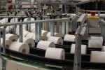 Rolls of tissue paper on an automated assembly line