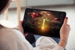 Woman watching a movie on a tablet computer