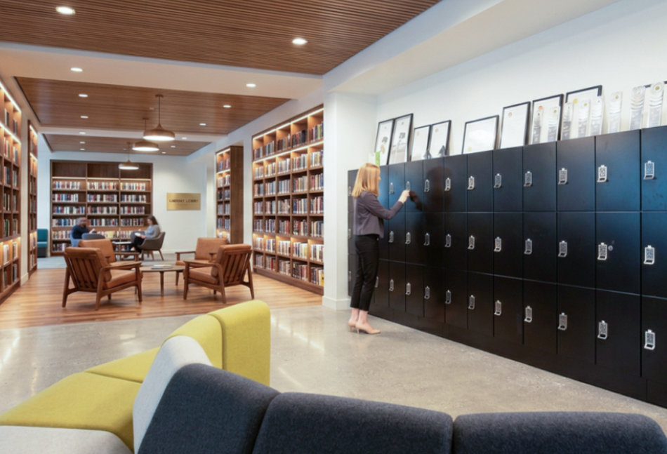 Woman at a bank of day-use lockers in a library
