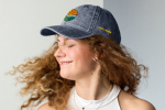 Woman modeling a Cobb County Library hat