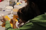 Parent and child work together on a paper craft