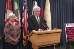 Texas Lt. Gov. Dan Patrick at a press conference with conservative activist Bonnie Wallace and a cover of Push, one of 2200 books on his dirty books list