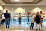 Public meeting where members of the public inspect plans for a library renovation