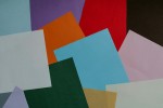 Messy stack of colored papers.